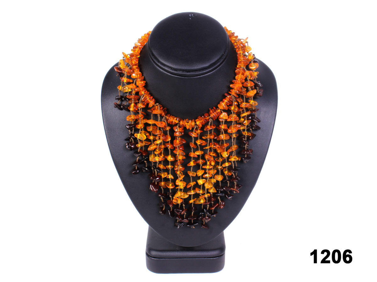 Front view of Real Baltic amber cascading necklace with cherry, honey and cognac amber pieces from Antiques of Kingston.