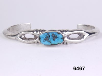 Front view of Vintage Native American silver bangle with turquoise stone from Antiques of Kingston.