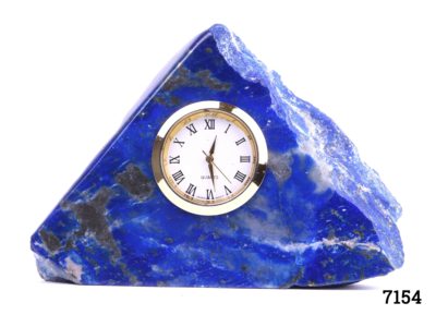 Lapis lazuli desk clock Modern battery operated clock set into a substantial piece of natural lapis lazuli stone In full working order Clock measures 35mm in diameter Main photo of the front of clock