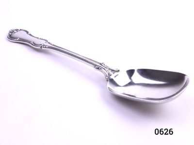 Sterling silver jam/sugar spoon in Princess pattern Fully hallmarked c1906 London assayed & made by Goldsmiths & Silversmiths Co Photo of spoon from a slight angle