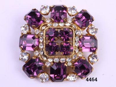 Costume jewellery vintage brooch with amethyst coloured and clear glass stones Measures 40mm square Close up photo of brooch front