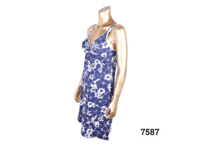 Original 1960s St Michaels mini dress in blue and white floral pattern. Size 10. (Some staining on inside bust area) Photo of dress from a side angle