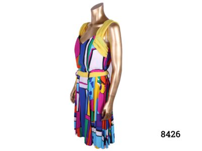 Vintage French multi-coloured dress with in a Mondrian style with block colours and yellow (chiffon?) accent on shoulders, neck & waist c1970s Made in Paris Size 10-12 Photo of side view of dress