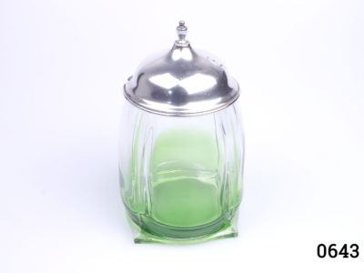 Vintage American silver lidded glass pot. Unusual shaped pot with square base and circular top with green tint to the base. Monogrammed with the letter E to the top of the lid. Base measures 65mm square and top opening measures 62mm in diameter Photo of pot with lid in place from a slightly raised angle