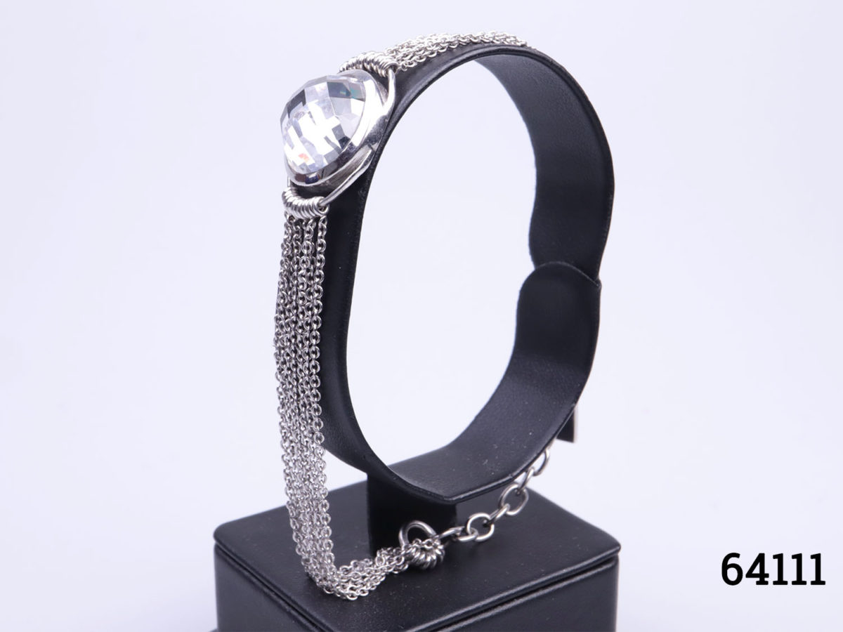 Vintage Vallès Dordal Paris sterling silver bracelet. Designer bracelet with 7 silver chain strands either side of faceted crystal ball in the centre. Slightly adjustable from 175mm to 210mm Bracelet weighs 15.2grams Photo of bracelet on a display stand from a side angle