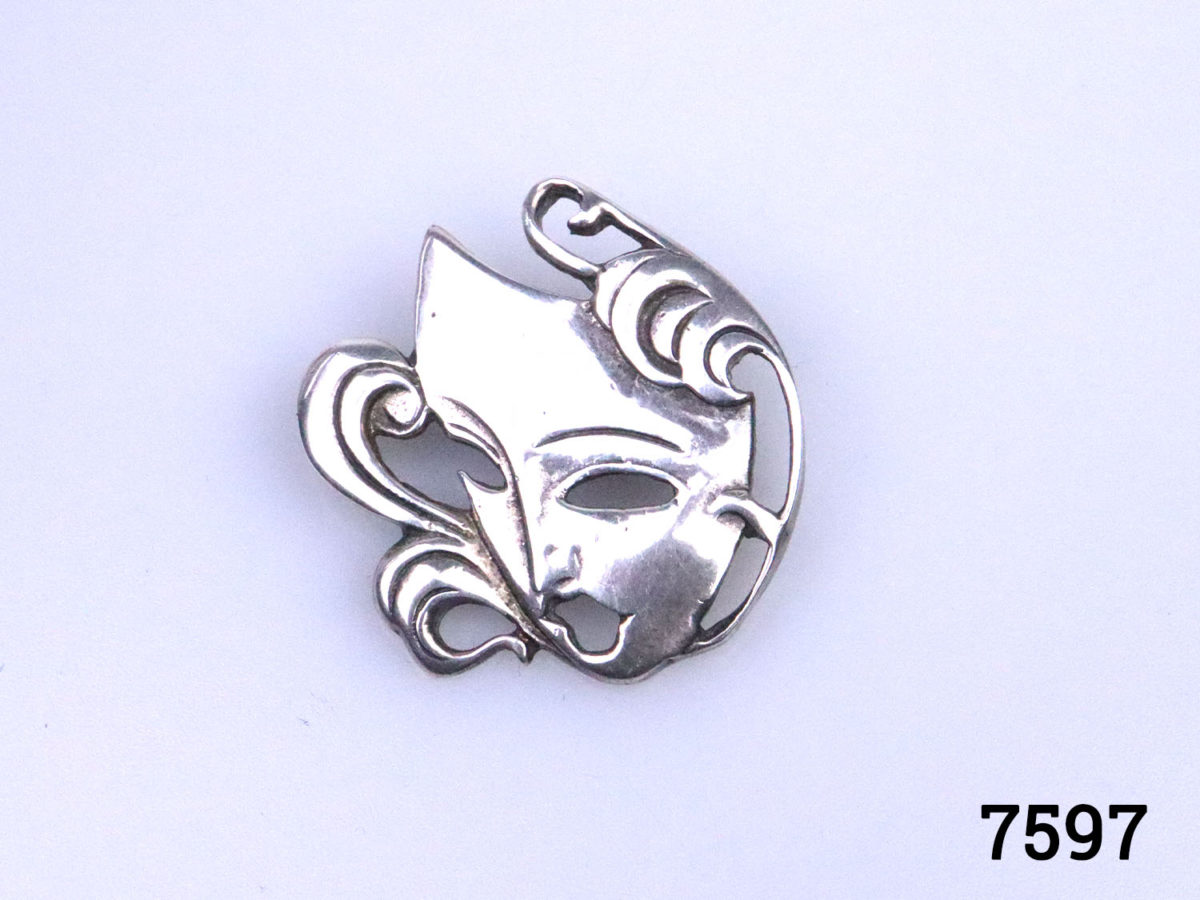 Vintage silver Art Deco style mask brooch. Full hallmark on back for Sheffield assay c1990 Main photo showing brooch front