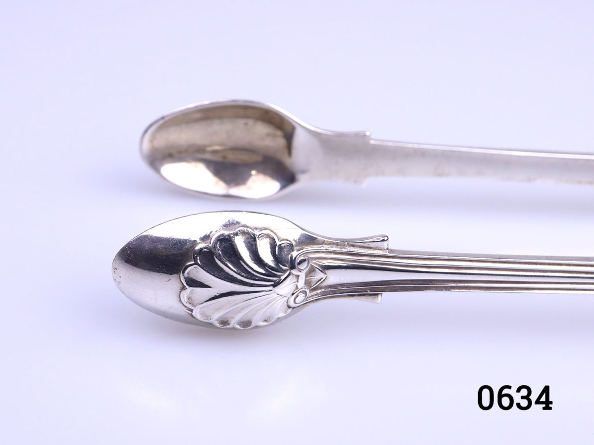 c1843 Fiddle thread shell tongs by George Adams. Fully hallmarked Close up photo of the scalloped spoon ends