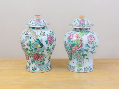Pair of vintage ginger jars with lids. Colourfully hand-painted ginger jars with phoenix birds and flowers. The tops of each lid is a different colour (Pot luck origin - the bottoms were shipped out first with lids following) Measures 215mm in diameter at base, 132mm in diameter at top, 195mm in diameter at widest part and 440mm high including lid