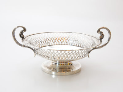Antique Mappin & Webb two handled tazza. Fine pierced lattice work to the side with 2 stylised handles. c1924 Birmingham assayed. Measures 72mm in diameter at base. Height at handles 75mm Main photo of tazza seen with the ornate handles to the left & right of bowl