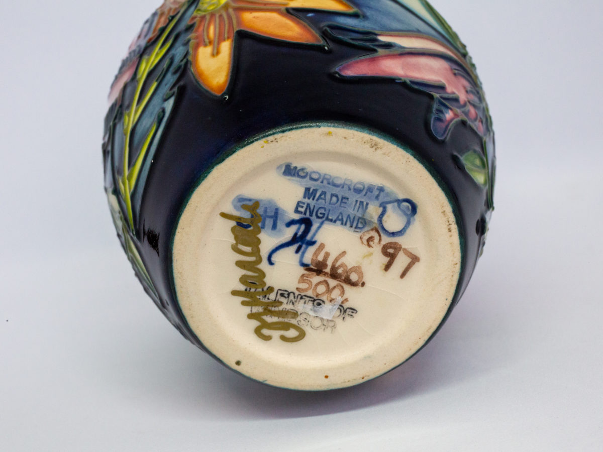 Moorcroft 'Castle Garden' vase. Issued in a limited edition of 500, this vase was designed by Debbie Hancock and dated c1997. Measures 45mm in diameter to the base, 75mm in diameter at widest part and 38mm in diameter at opening. Photo of base of vase.