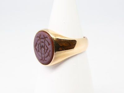 Vintage 9 karat gold seal ring. A nice solid ring in 9 karat gold with superimposed letters C, D & A in intaglio (hollow relief) to the agate stone. Hallmarked 9ct to inside band. Ring front measures approximately 14mm by 12mm. Box included. Ring size R / 8.5 Ring weight 8.9gms. Photo of ring on a cone shaped stand and seen with ring front facing left of photo.