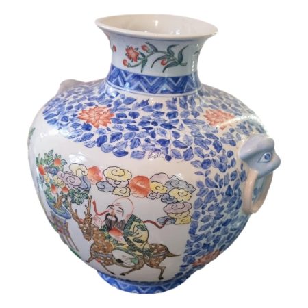 Main photo showing pot from a slight side angle with main image side facing left and one of the lion head handles to the lower right of photo.