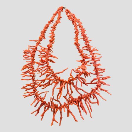 Main photo of necklace displayed on a flat surface showing the 2 strands clearly. Clasp is to the top of picture.