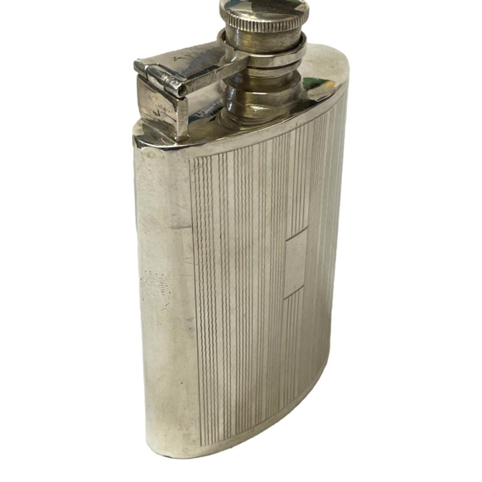 Here the flask is posed at a sideways angle with the vacant panel facing bottom right.