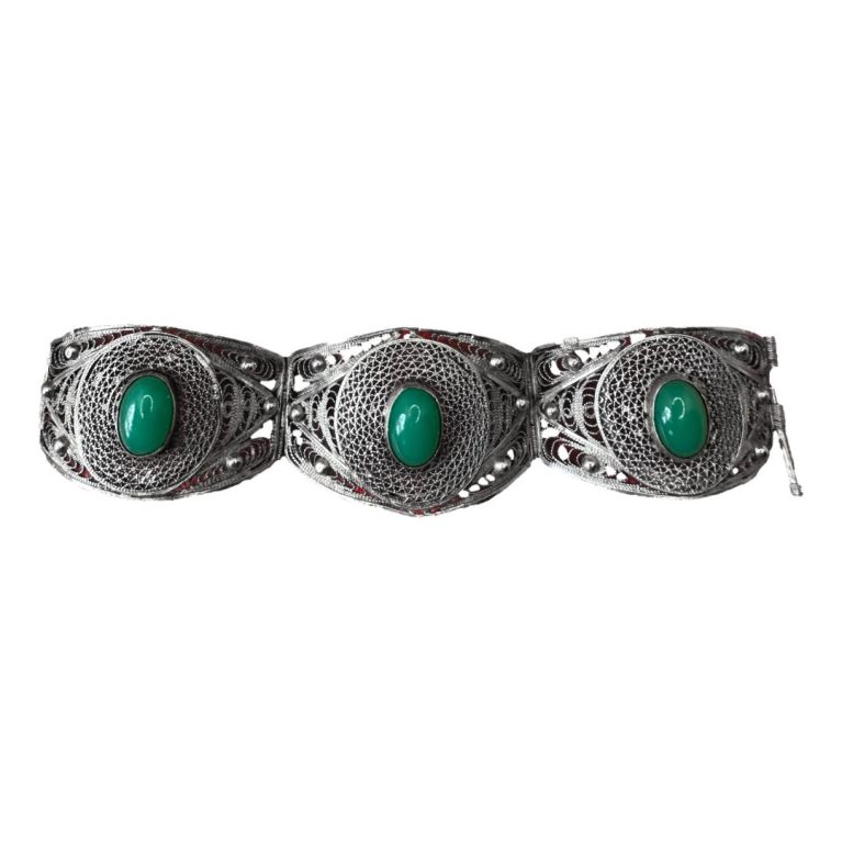 Main photo of Egyptian silver chrysoprase bracelet laid out in a straight line from left to right showing all 3 panels with cabochons to the centre of each. There is a slight red tinge on the photo from the background used at time of photography and not part of the bracelet!