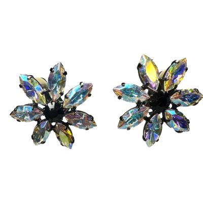 Vintage pair of Butler & Wilson 1980s clip on aurora borealis flower earrings. Main photo of both earrings side by side and showing the different colours of the aurora borealis crystals