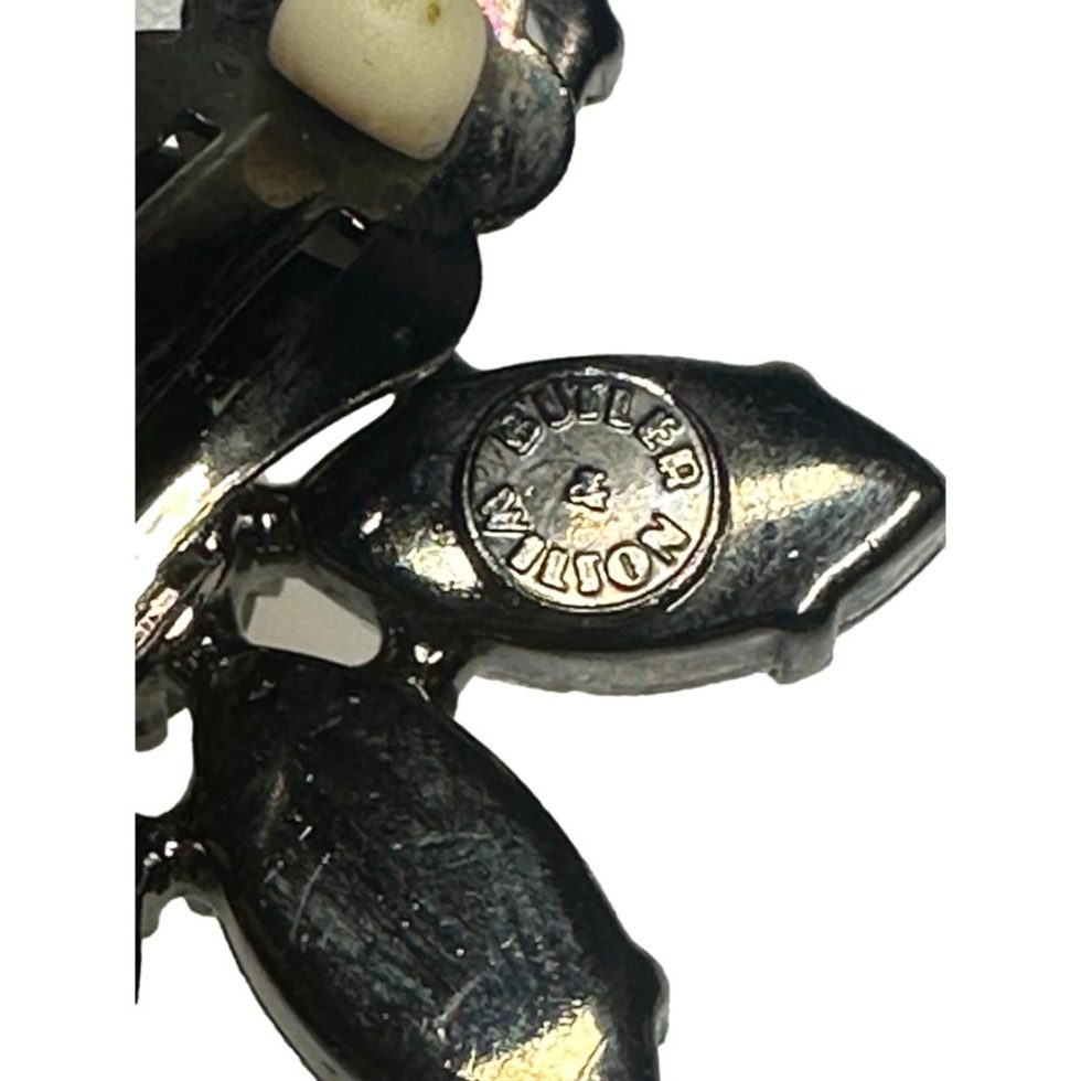 Close up photo of the Butler and Wilson disc on the back of one earring.