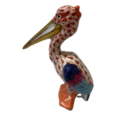 Vintage Herend porcelain pelican in red fish scale pattern. 24karat gold to beak and tips of web feet. Hand-painted and numbered to the base. No.148. Main photo of pelican seen from a side angle with the beak facing left of photo.