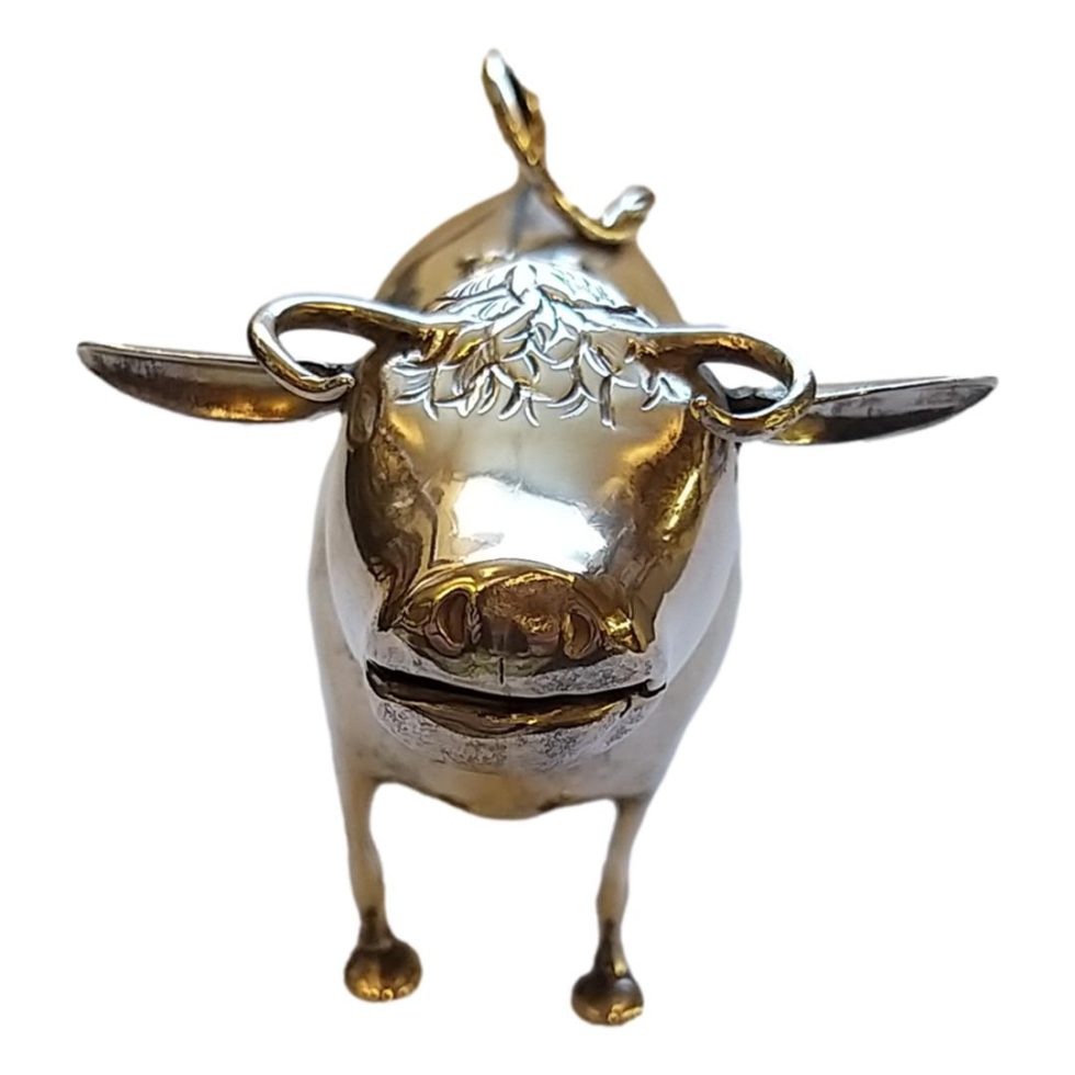 Photo of the head end of cow with the mouth formed to be the spout.