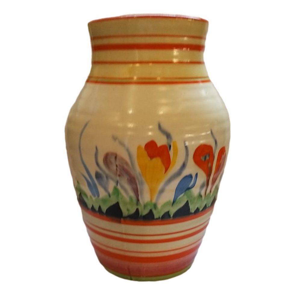 Photo of vase in close up with the more orange crocuses are on display.