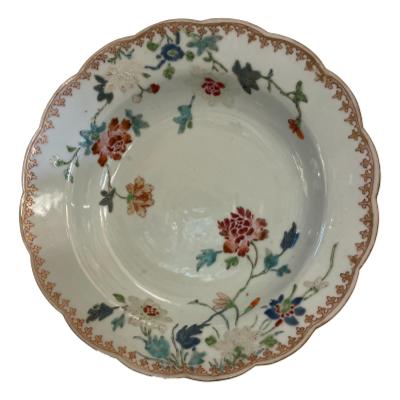 Early 19th century shallow bowl from the Qianlong era (1736-1795). Wonderful example of fine Chinese famille rose pottery with hand-painted peony motif. Some minor signs of wear consistent with age. Measures 230mm in diameter. Main photo of bowl displayed upright on a stand
