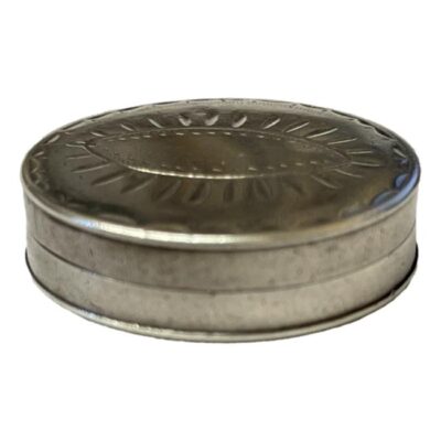 Very small antique sterling silver patch pot c1816 Birmingham assay by Samuel Pemberton. Decoration to the lid with patch design to the lid. Hallmark to both inside halves. Small dint to the base. Measures 24mm in diameter and 6mm deep. Photo of box from a near eye level angle to show the depth.