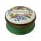 Main photo of box seen from a slightly raised angle showing the design on the lid and green enamel to the sides.