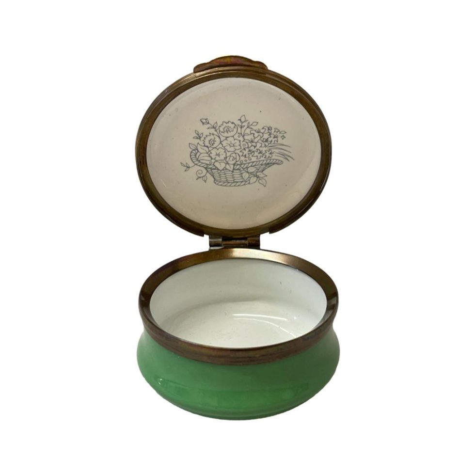 Photo of pot with lid open showing the basket with flowers on the underside of lid.