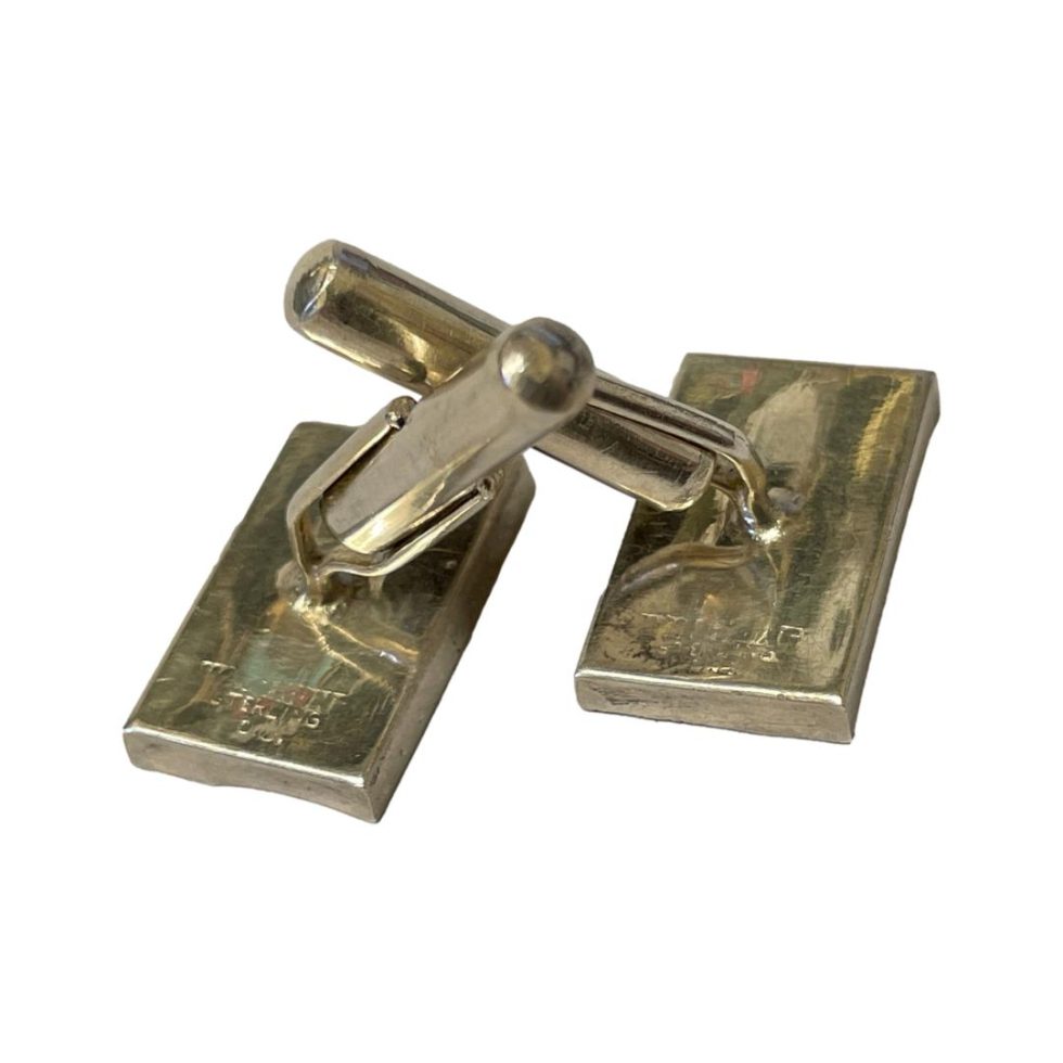 Photo of both cufflinks laid facedown showing the back. Hallmark is also visible.
