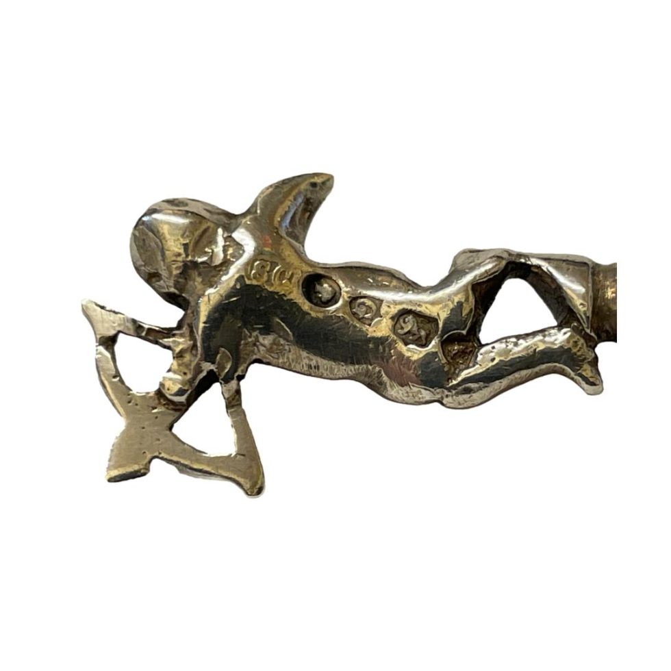 Photo of the back of cherub showing the full hallmark.