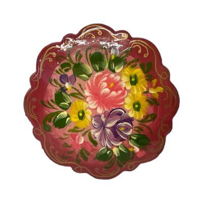 Vintage hand-painted lacquered brooch. Pretty circular Russian lacquered brooch hand-painted with flowers and foliage. Initialled to the back. Some wear of the black to the back of brooch. Main photo of brooch front.