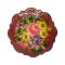 Main photo of brooch front. The base colour is a deep pink with flowers in yellow, purple, lighter pink and with green leaves.