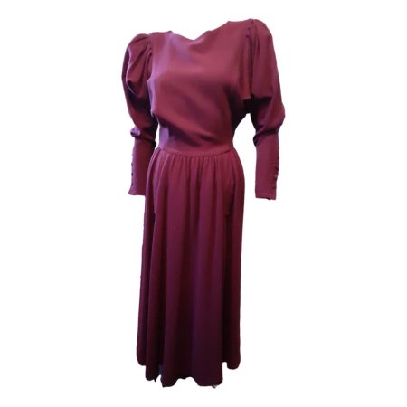 Main photo of full length of dress seen from the front. Stunning colour like a fine claret. Fitted waist, puffed upper arms and fitted below the elbow with buttons detail. Very classy and sassy little number!