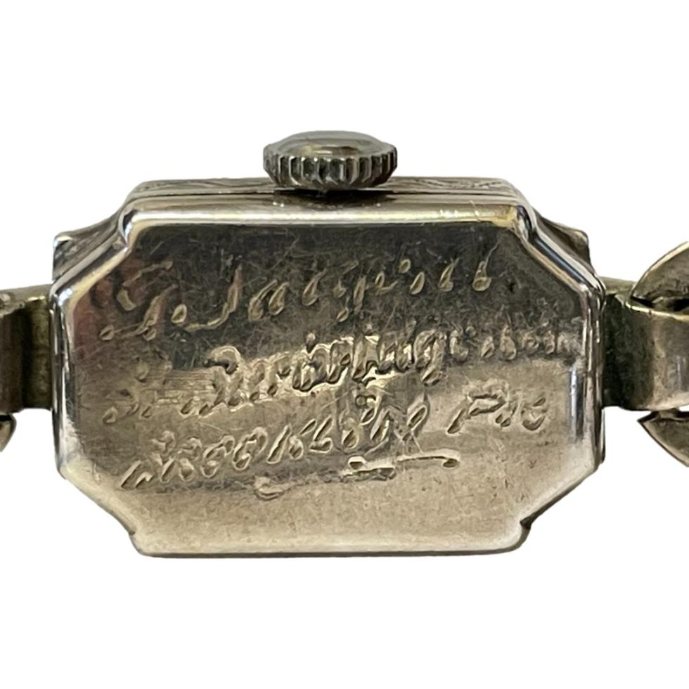 Close up of the wording at back of watch