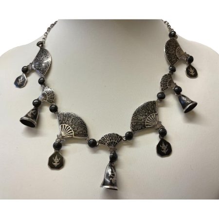 Main photo of necklace displayed on a stand and shown from the front. The necklace is a collar style which sits nicely around the collarbone .
