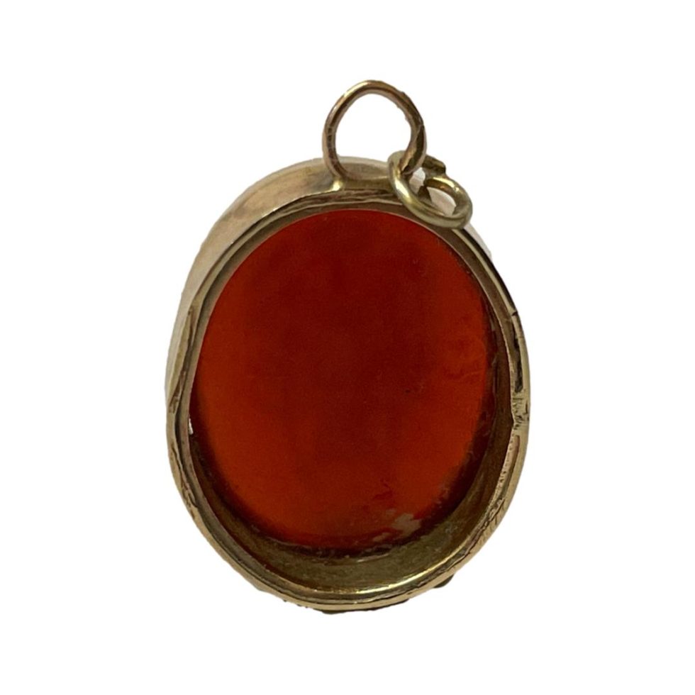 Photo of the back of pendant showing that the carnelian stone does not extend all the way to the back.