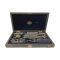 Main photo of open case seen from the front opening end with all the instruments in their place. Makers stamp in gold to the centre of the velvet lining of inside lid.
