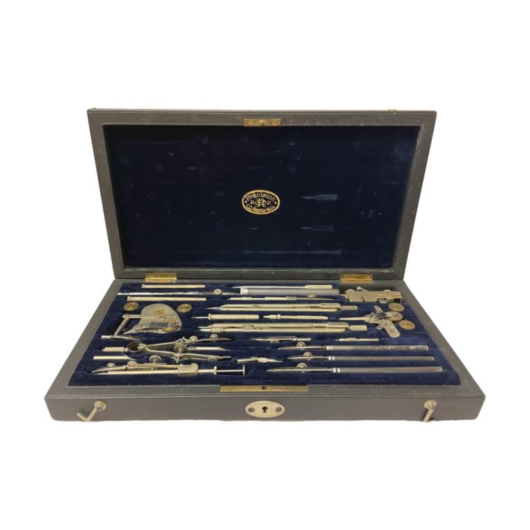 Main photo of open case seen from the front opening end with all the instruments in their place. Makers stamp in gold to the centre of the velvet lining of inside lid.