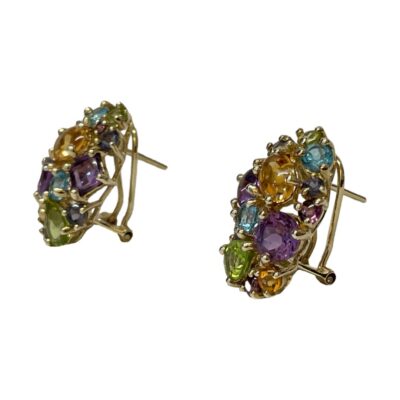 Multi gem earrings set in 9 karat gold. Pair of modern earrings in 9 karat gold set with multiple semi precious gems including amethyst, peridot and citrine. Secure lever back fastening. Hallmarked to the earring posts and hinge base of levers. Earring fronts measure approximately 23mm long by 15mm at widest. Photo of both earrings seen from a slight side angle with the front of earrings facing towards the left.