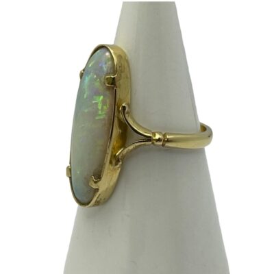 Photo of ring on a cone shaped stand with ring front facing left. The split band shoulder detail is shown.