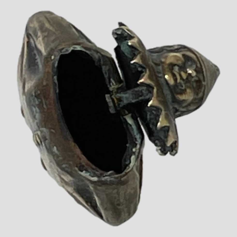 Photo of clown vesta seen from above with the head back and looking into the body of the case/clown