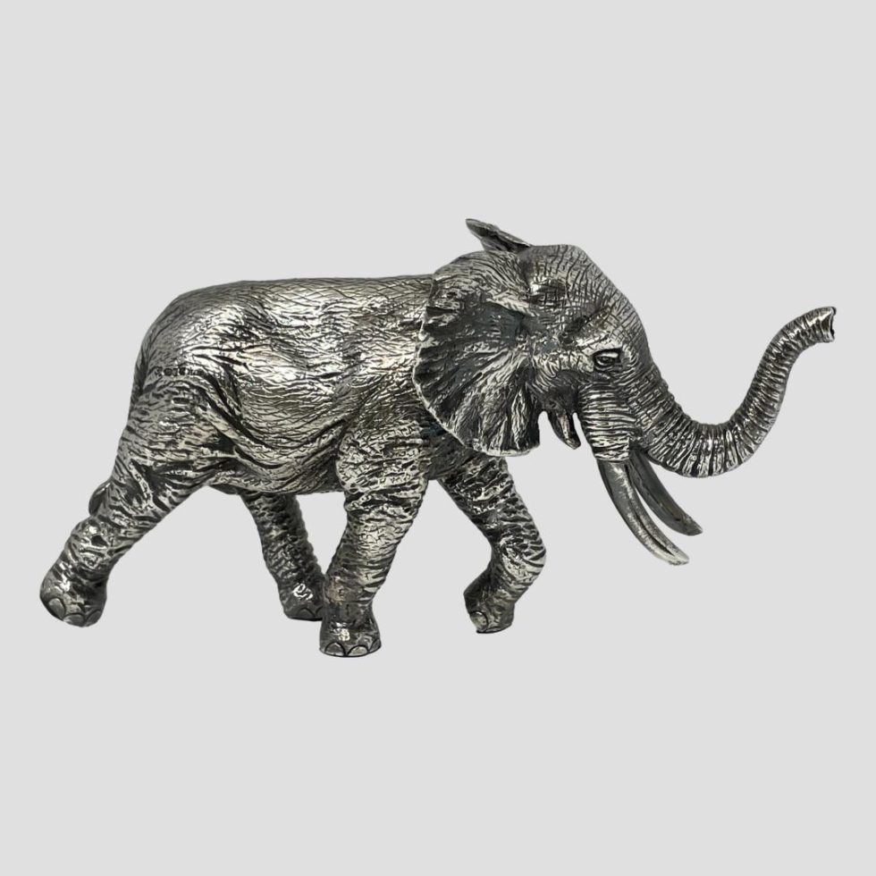 Elephant in profile facing right.