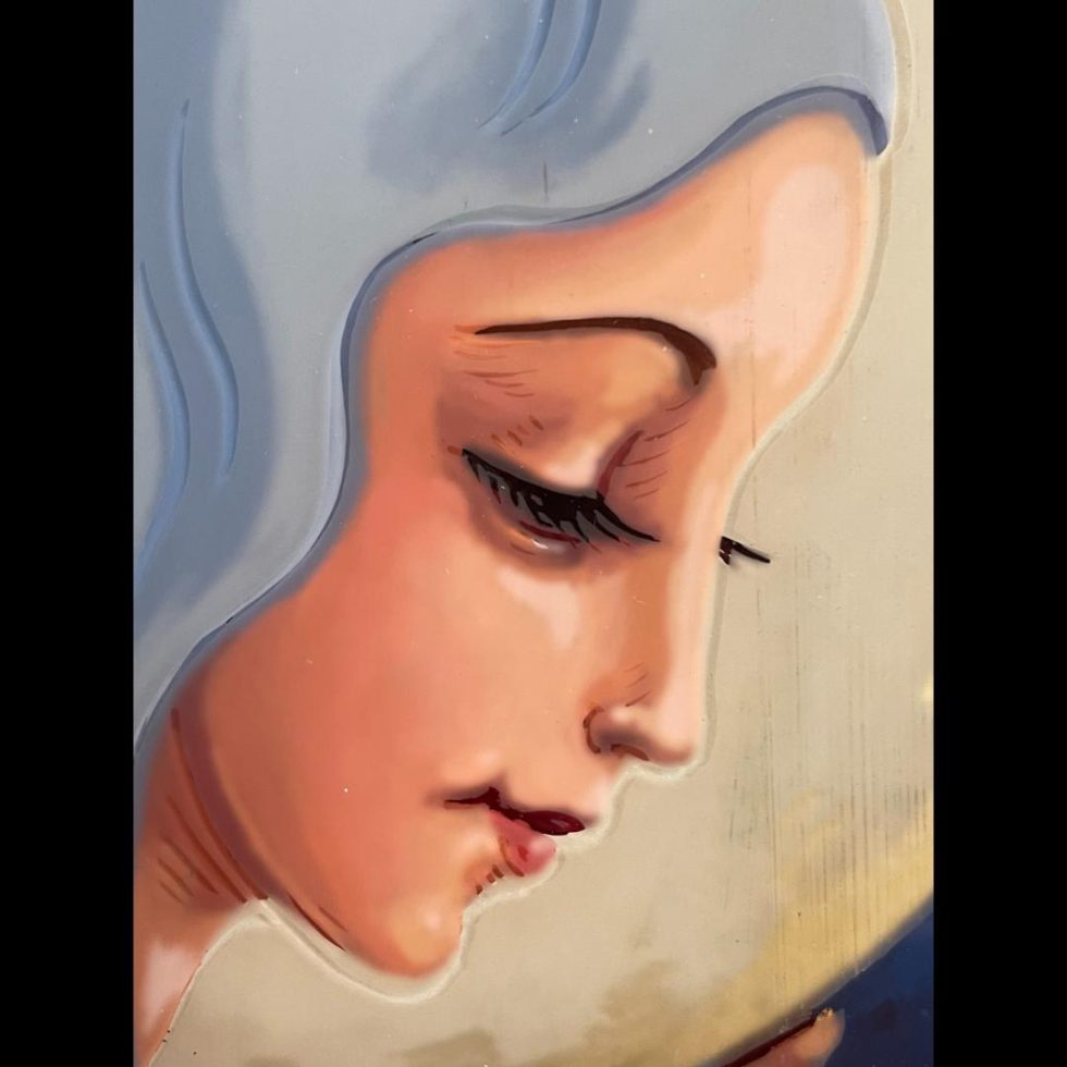 Close up image of the Virgin Mary's face which has a great calm essence.