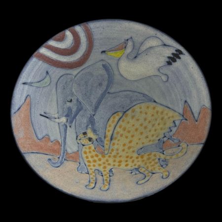 Main photo of Tessa Fuchs animals bowl showing the incredible art work in the bowl centre. The sun is to the top left with crescent moon just below it. The pelican in flight is just right of the sun, the elephant to the centre and the winged cheetah creature in the foreground and there is a red mountain range in the background. All creatures are facing and heading left.