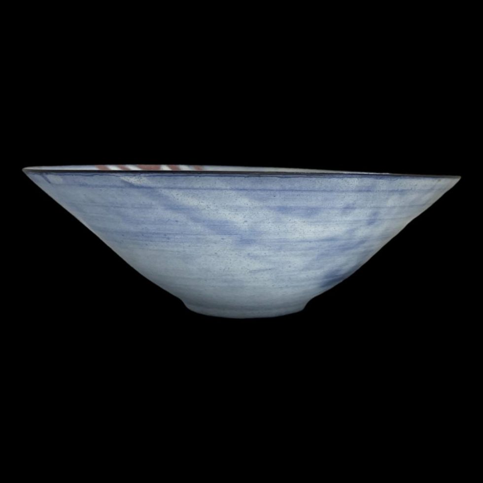 Photo of Tessa Fuchs animals bowl seen from an eye level showing the cone shaped design.