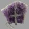 Main image of the large silver amethyst cross and chain with the cross leant up against a rock of amethyst crystal and the chain extended up and over the rock and reappearing from the lower left of rock with the clasp ends in the foreground.