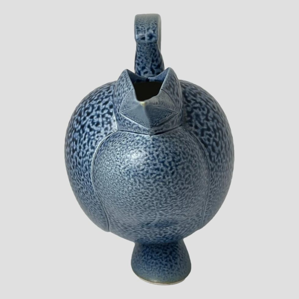 The Anthony Theakston egret jug is looking straight to camera from an eye level. At this angle it is difficult to see the length of the beak or shape of the handle or even if its a bird at all!