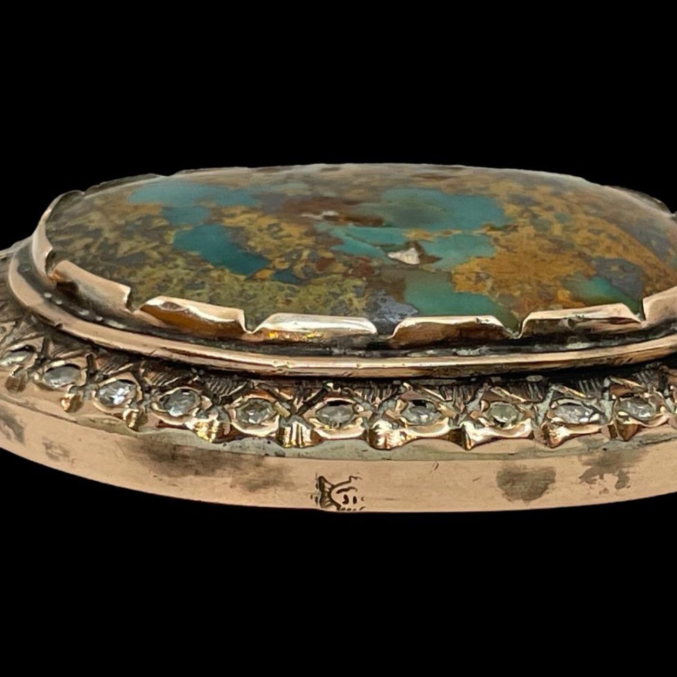 Close up of one of the unidentified hallmarks on one side of the outer gold frame.