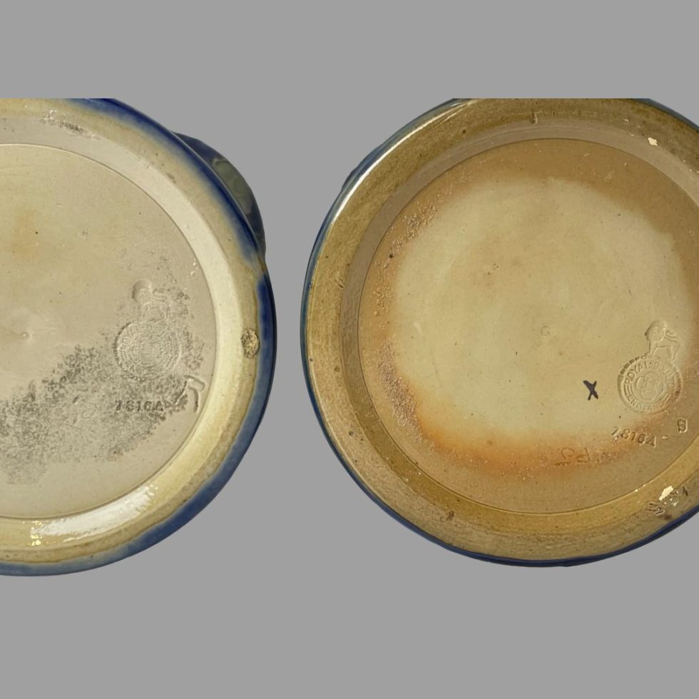 Close up photo of the bases of both tall Doulton rose vases showing the makers stamps on each.