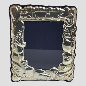 Main photo of toy theme photo frame seen with the front of frame forward facing. The frame is made up of toys from teddy bears, hobby horse, trains amongst others and would be ideal for displaying a child or grandchild's photo. Would be a lovely gift item to give to parents or grandparents with photo included. Hallmark is just visible to bottom left below the rubber duck and building blocks.